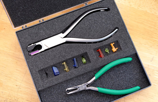 Optician repairing Equipment and fixing eyeglasses, Toolbox Repair Tool. Tooling Parts.