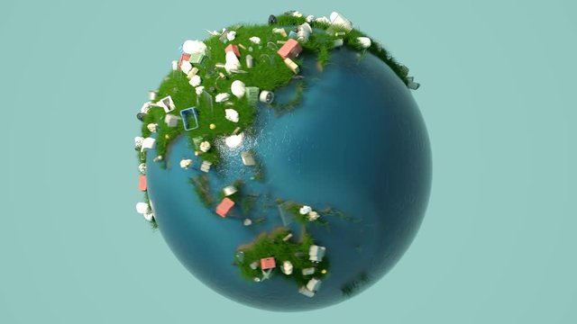 Earth globe with every kind of garbage appears on the land covered with grass