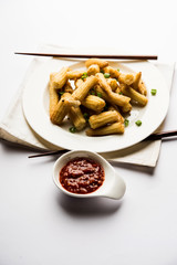 Baby Corn Manchurian dry - popular Indo-chinese starter recipe. selective focus