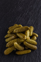 pickled vegetables on a dark stone background