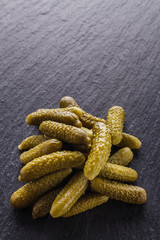 pickled vegetables on a dark stone background