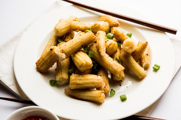 Baby Corn Manchurian dry - popular Indo-chinese starter recipe. selective focus