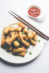 Baby Corn Manchurian dry - popular Indo-chinese starter recipe. selective focus