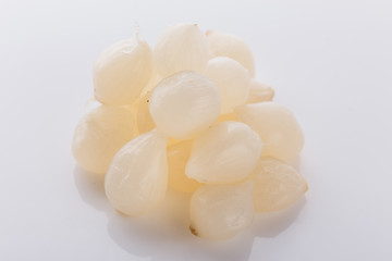 pickled vegetables on a white acrylic background