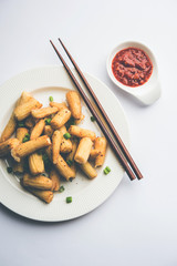 Baby Corn Manchurian dry - popular Indo-chinese starter recipe. selective focus