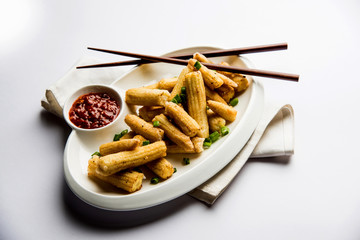 Baby Corn Manchurian dry - popular Indo-chinese starter recipe. selective focus
