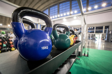 16 kilogram Kettlebells for exercise placed on shelf in gym