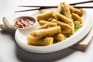 Baby Corn Manchurian dry - popular Indo-chinese starter recipe. selective focus
