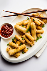 Baby Corn Manchurian dry - popular Indo-chinese starter recipe. selective focus
