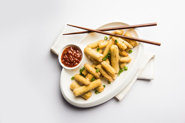 Baby Corn Manchurian dry - popular Indo-chinese starter recipe. selective focus