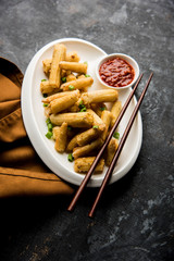 Baby Corn Manchurian dry - popular Indo-chinese starter recipe. selective focus