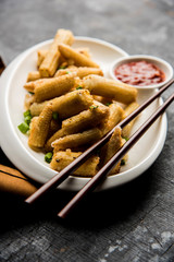Baby Corn Manchurian dry - popular Indo-chinese starter recipe. selective focus