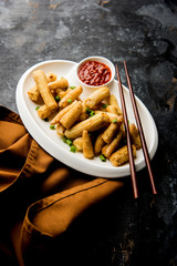 Baby Corn Manchurian dry - popular Indo-chinese starter recipe. selective focus