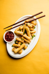 Baby Corn Manchurian dry - popular Indo-chinese starter recipe. selective focus