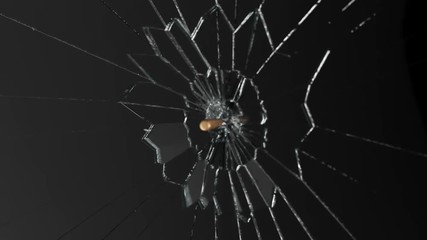 Slow-motion shot of a shiny bullet shattering a piece of transparent glass. 4KHD - Powered by Adobe