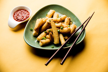 Baby Corn Manchurian dry - popular Indo-chinese starter recipe. selective focus