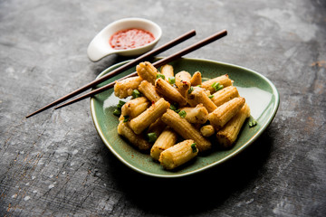 Baby Corn Manchurian dry - popular Indo-chinese starter recipe. selective focus
