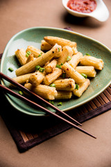 Baby Corn Manchurian dry - popular Indo-chinese starter recipe. selective focus