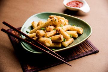 Baby Corn Manchurian dry - popular Indo-chinese starter recipe. selective focus
