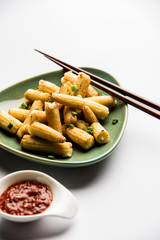Baby Corn Manchurian dry - popular Indo-chinese starter recipe. selective focus