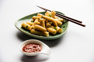 Baby Corn Manchurian dry - popular Indo-chinese starter recipe. selective focus