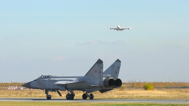 military aircraft, jet fighter flying on military base. Fighting falcon. Russian fighter aircraft. Close-up of an airplane. Russian and US Army. plane, airport, cold war, arms race, hostilities bomber