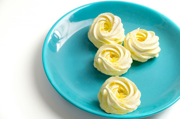 Homemade zephyr or marshmallow in blue plate