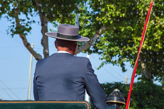 Conductor de coche de caballos en la feria de Abril / Horse car driver at the April fair. Sevilla