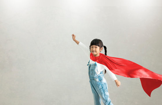 Asian Child Acting To Be Superhero.Imanigination And Success Concept.Play Creative Thinking In Kid.