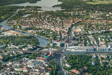 old town Berlin Spandau with town hall, train station and "Spandau Arcaden" in front, with the river Havel and Wannsee in the background © Mario Hagen