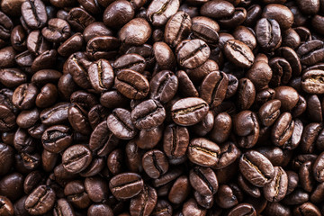 Roasted coffee beans. Food and drink background. Top view.