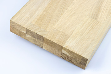 Glued wood structure. Lumber industrial wood texture, timber butts background.  Butt end of a processed wooden beam. Glued beams.  