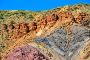 Fototapeta premium Texture of unrealy beautiful colorful clay cliffs in Altai mountains, Russia
