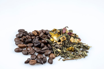 Coffee beans and green loose tea isolated on white background