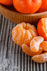 juicy mandarin on a gray wooden rustic background