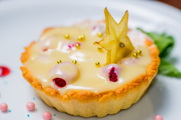 sweet tart with cream and berries