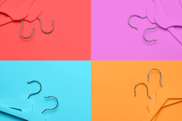 Creative fashion concept. Flat lay top view colored wooden hangers on multi-colored background minimalism style pop-art. Sale discount store shopping concept, design empty hanger feminine blog