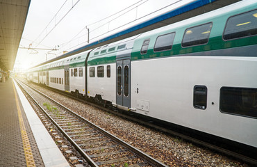 Naklejka premium Double-decker train at the railway station in Italy.