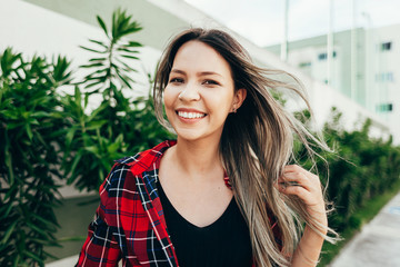 Portrait of beautiful young woman in the city