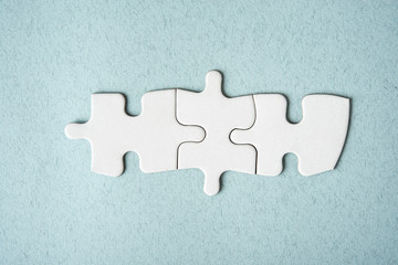 Blank puzzle top view - on blue background