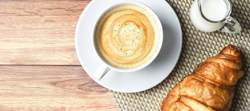 Perfect Breakfast Of Croissant And Coffee With Milk On Wooden Table. Rustic Style. Top View.