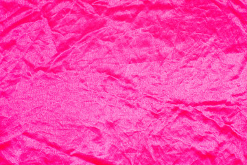 The texture of the silk fabric rose-color, pink crumpled silk texture