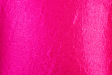 The texture of the silk fabric rose-color, pink crumpled silk texture