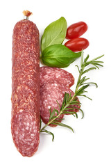 Smoked salami sausage with basil, dried meat, top view, isolated on white background
