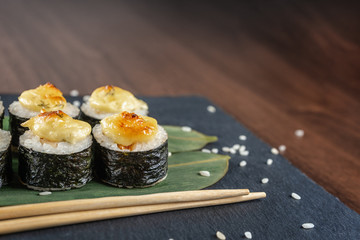 Rolls on bamboo leaves on shale Board, copy space