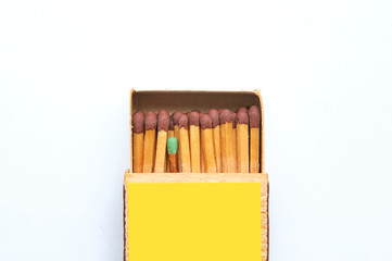 A box of matches in which one is different from all.