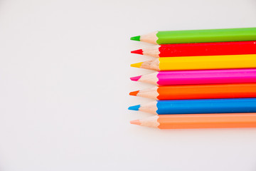 Naklejka premium Drawing supplies: assorted color pencils, isolated on white background.Colorful pencils.Back to school.Education concept.Copy space
