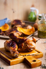Baked chicken legs with butternut squash and thyme herb