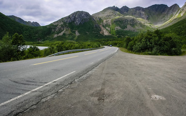 The coast of the Norwegian fjord with the road running along