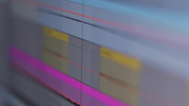 Audio track waveforms playing in music production software at home studio